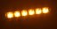 Pohled na rozsvícený oranžový LED predátor